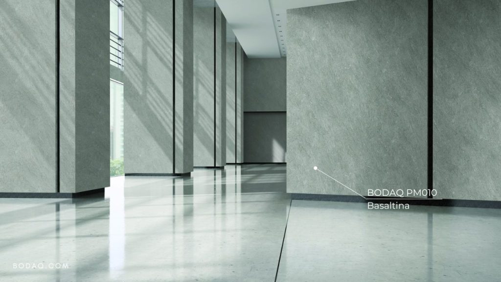 Transforming Hotels with Bodaq Finishes 12 PM010 Basaltina used to refinish lobby wall panels without structural changes to the hotel lobby.